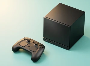 Черный игровой блок с контроллером на светлом фоне.