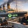 На фоне океана плывёт лайнер «Титаник» с логотипом Xbox, рядом человек в свитере.